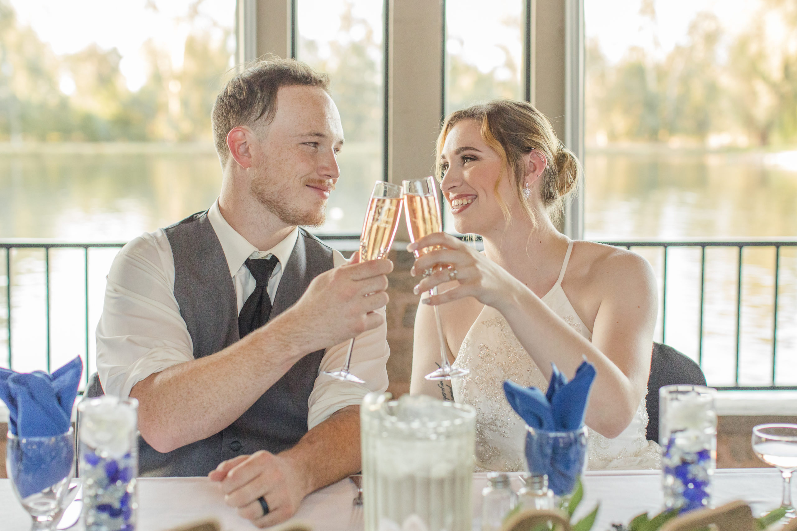 Wolf Lakes Wedding toasting bride and groom