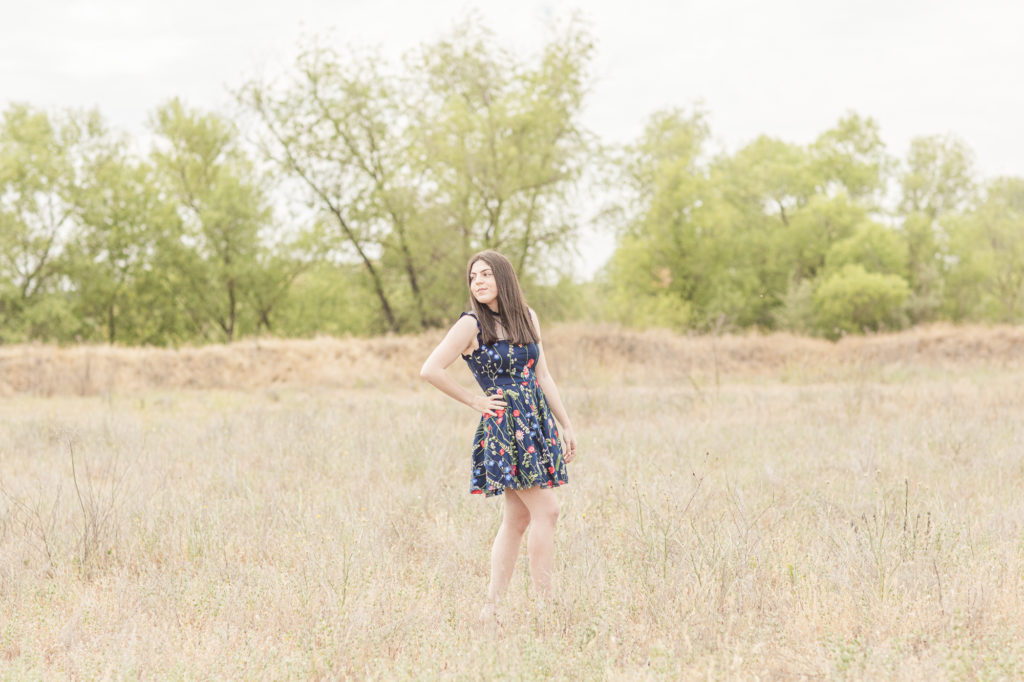 girl posing in a field