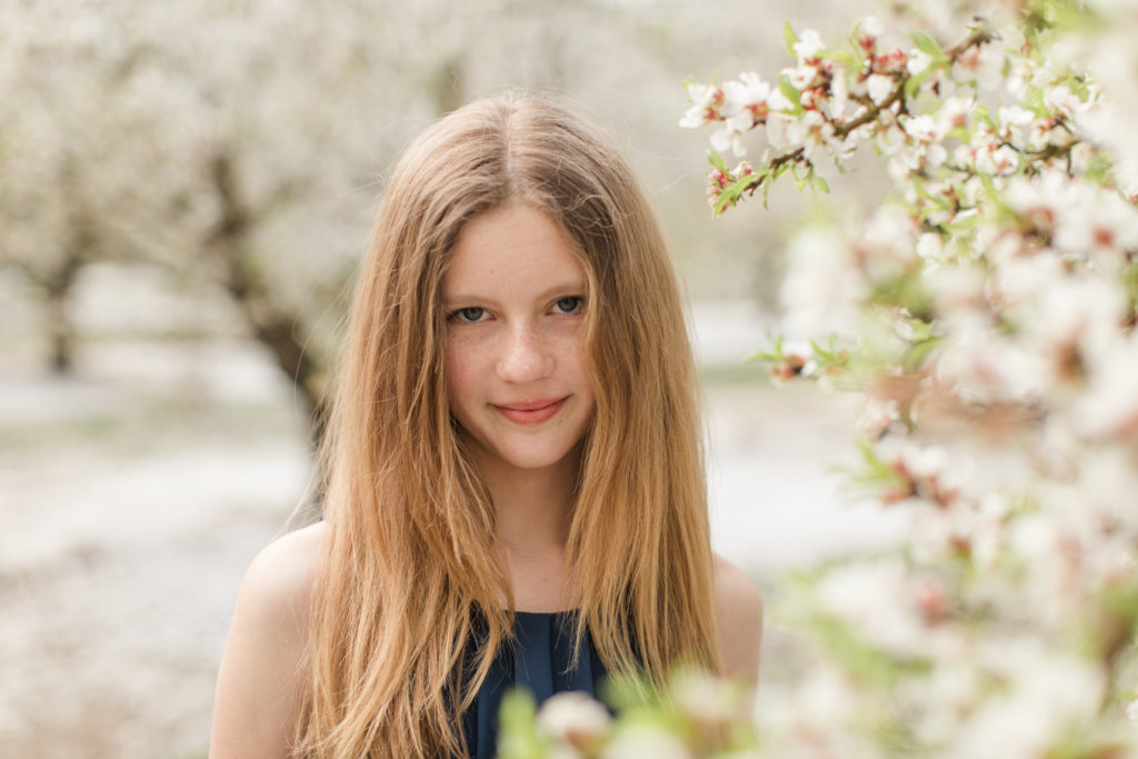 girl by blossoms