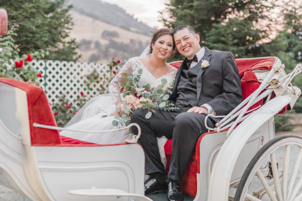 bride and groom in carriage - wonder valley ranch wedding