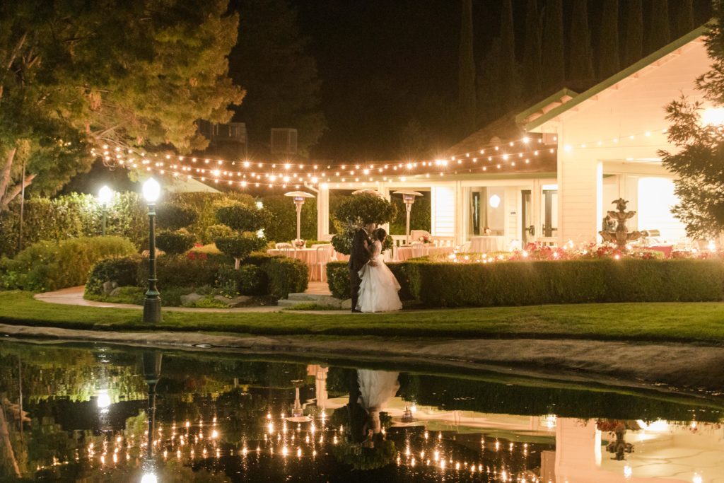 couple by lake - wonder valley ranch wedding 
